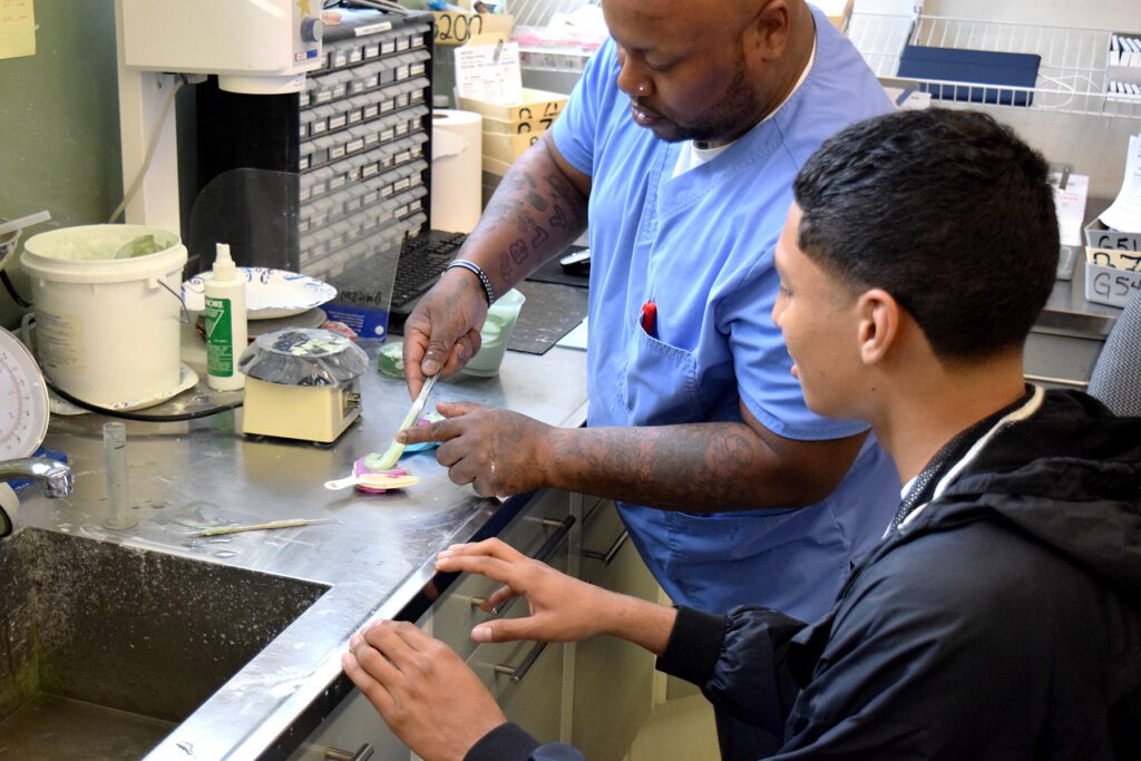 OHM Student Brian Acevado works with Jason of Utica Dental Lab